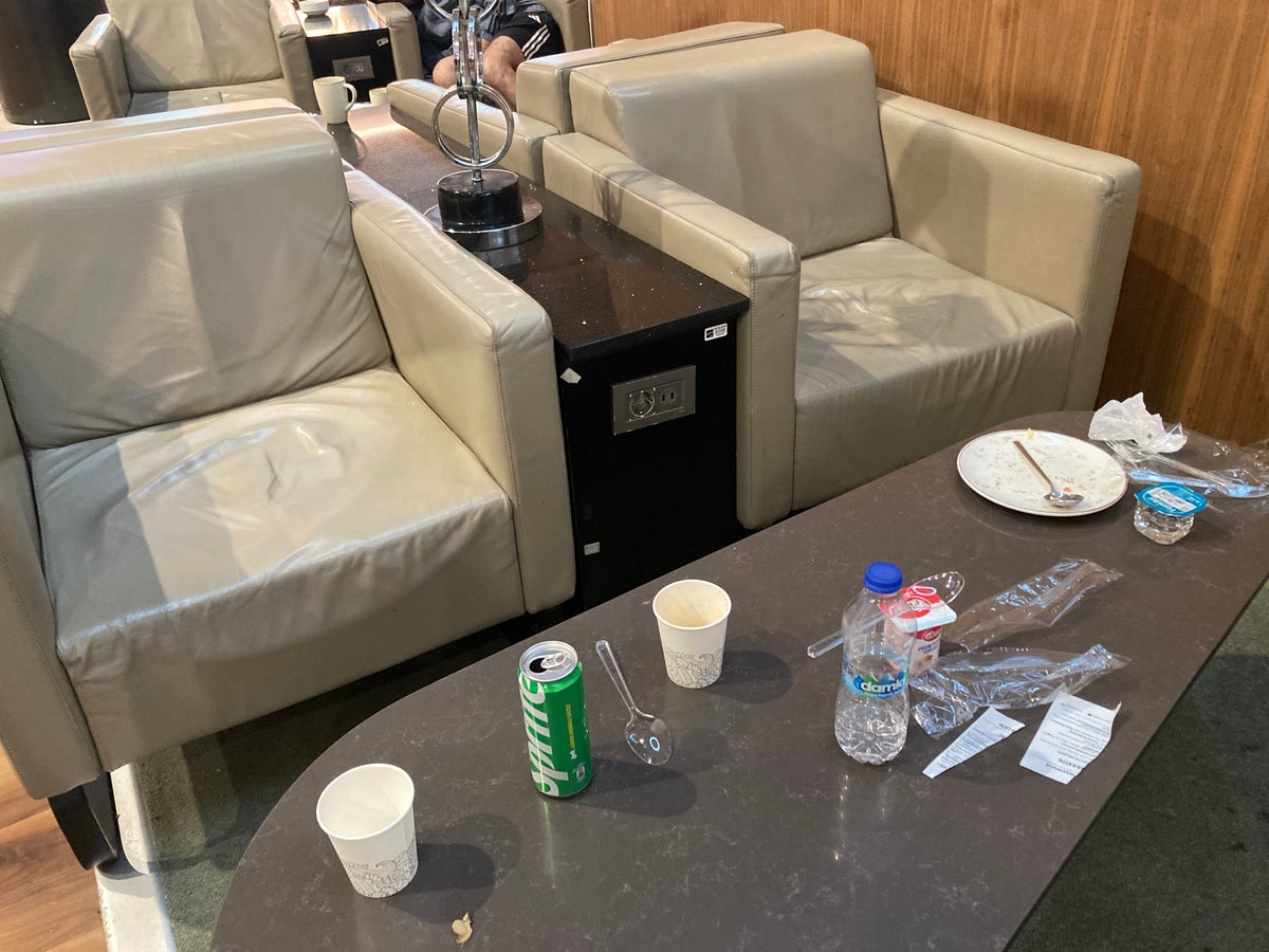 IGA Lounge IST trash on table