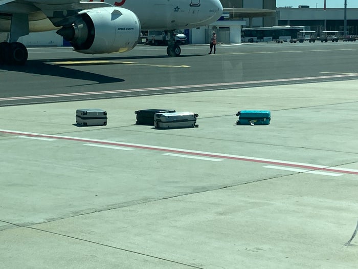 ITA baggage on tarmac seen from shuttle ITA baggage on tarmac seen from shuttle