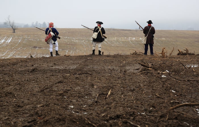 Reenactors Overlooking Mowed Meadows