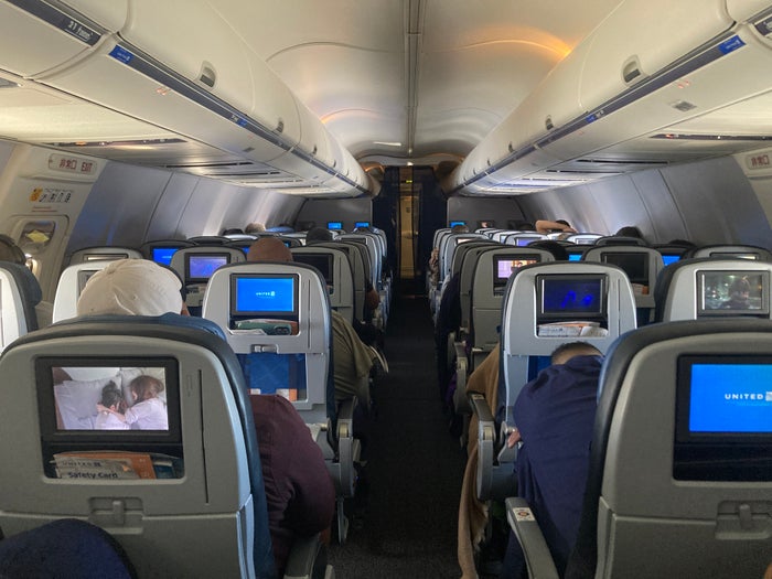 United economy multimedia view United B737 800 Island Hopper HNL PNI economy cabin view from back