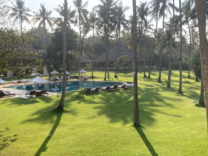 Alila Manggis Bali bedroom view from balcony to pool Alila Manggis Bali bedroom view from balcony to pool