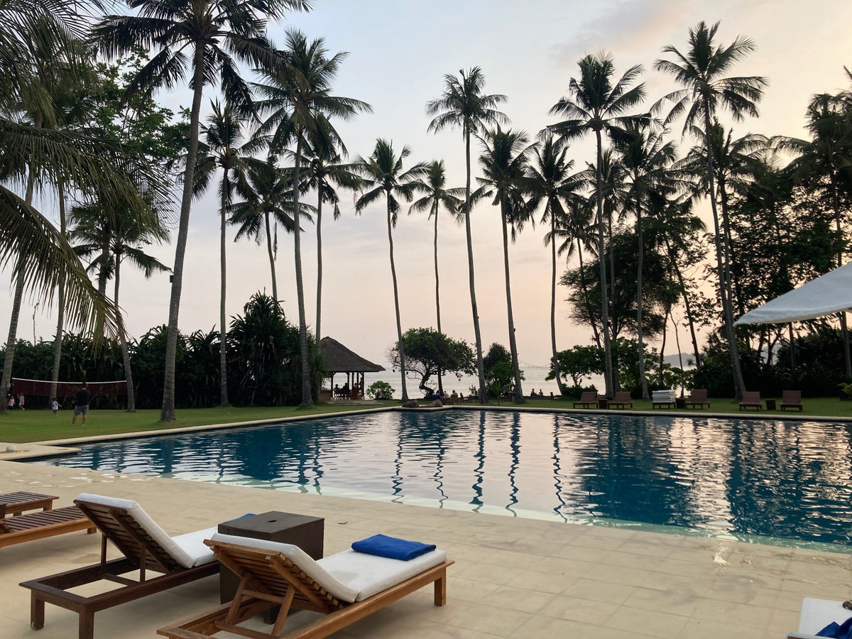 Alila Manggis Bali pool at sunset