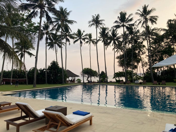 Alila Manggis Bali pool at sunset Alila Manggis Bali pool at sunset