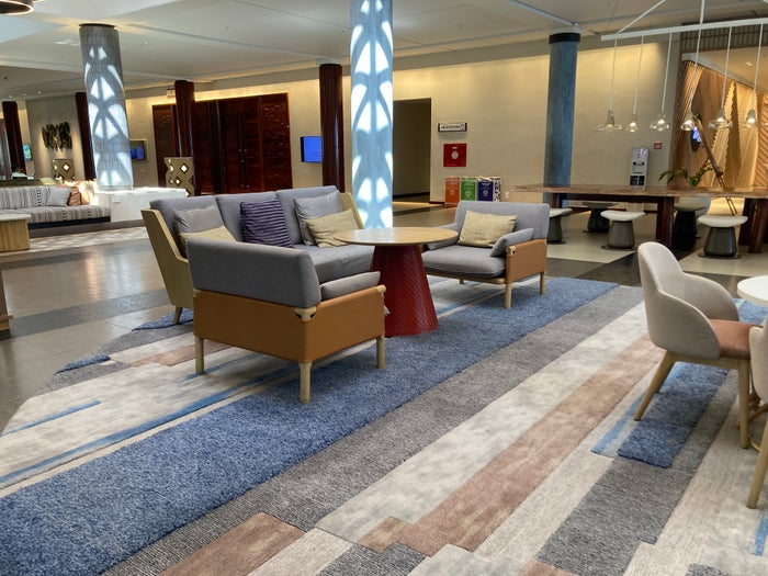 Sheraton Fiji Golf and Beach Resort lobby seating with tables Sheraton Fiji Golf and Beach Resort lobby seating with tables