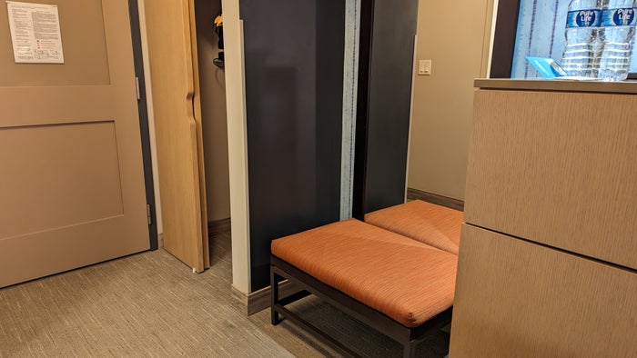 SunCoast Park Hotel Anaheim guestroom bench and closet SunCoast Park Hotel Anaheim guestroom bench and closet