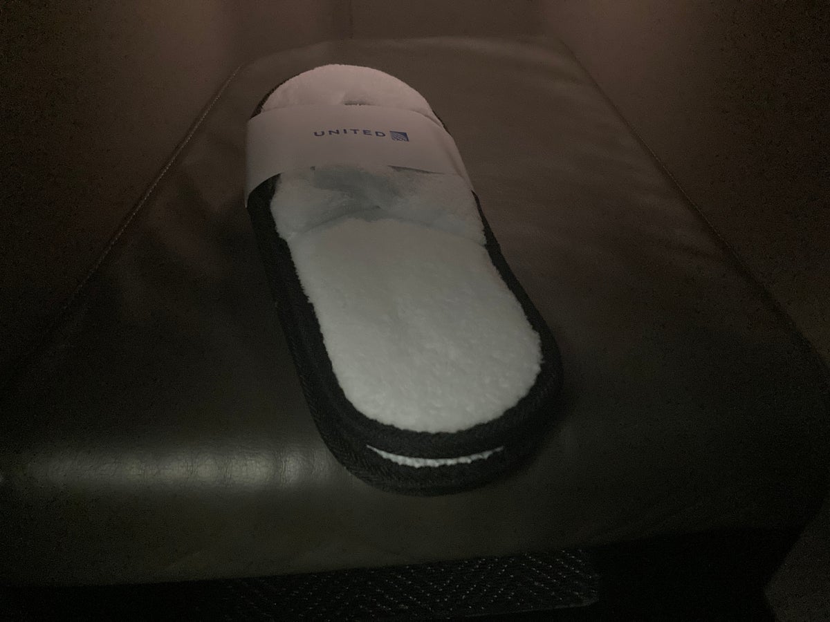United Polaris business class 787 10 slippers in foot well HND LAX