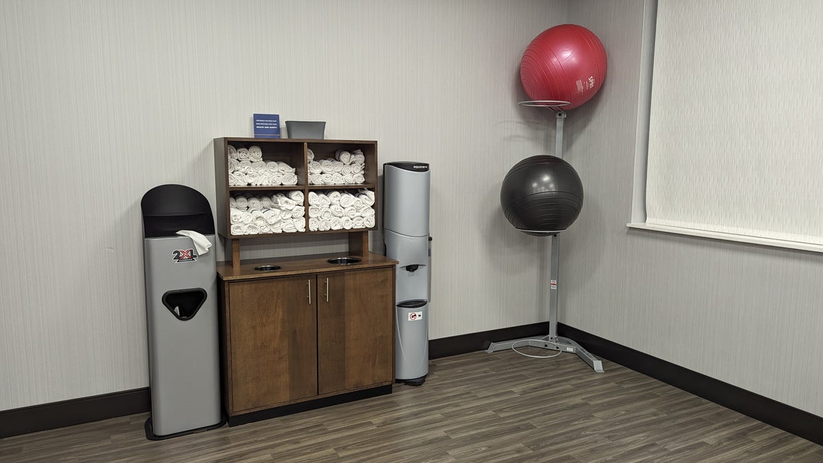 Hampton Inn and Suites Aurora South Denver amenities fitness center towels water and balance balls