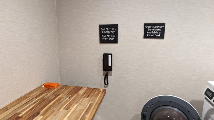 Hampton Inn and Suites Aurora South Denver amenities laundry room table and phone Hampton Inn and Suites Aurora South Denver amenities laundry room table and phone