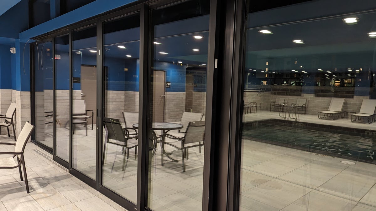 Hampton Inn and Suites Aurora South Denver amenities pool patio doors