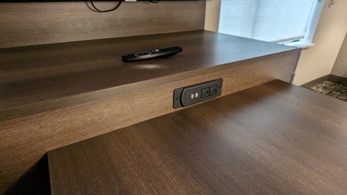 Hampton Inn and Suites Aurora South Denver room entertainment center and desk plugs Hampton Inn and Suites Aurora South Denver room entertainment center and desk plugs