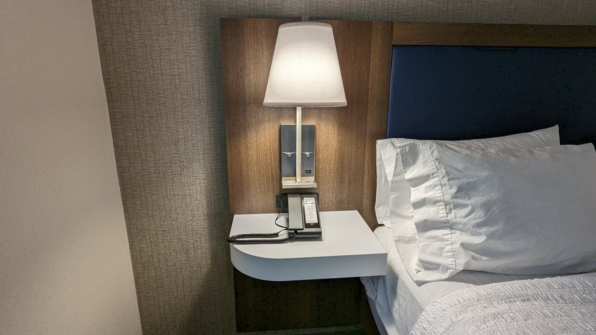 Hampton Inn and Suites Aurora South Denver room second nightstand with phone