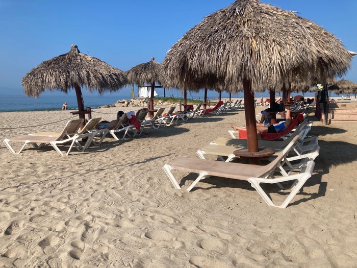Sunscape Puerto Vallarta Resort Spa beach loungers with umbrellas Sunscape Puerto Vallarta Resort Spa beach loungers with umbrellas