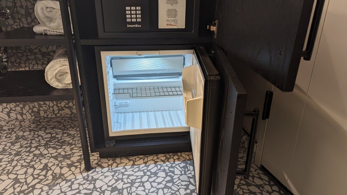 Motto by Hilton New York City Times Square guestroom bathroom fridge open Motto by Hilton New York City Times Square guestroom bathroom fridge open
