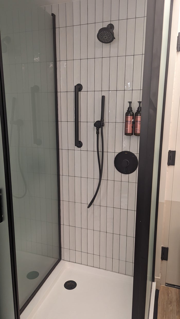 Motto by Hilton New York City Times Square guestroom bathroom shower enclosure Motto by Hilton New York City Times Square guestroom bathroom shower enclosure