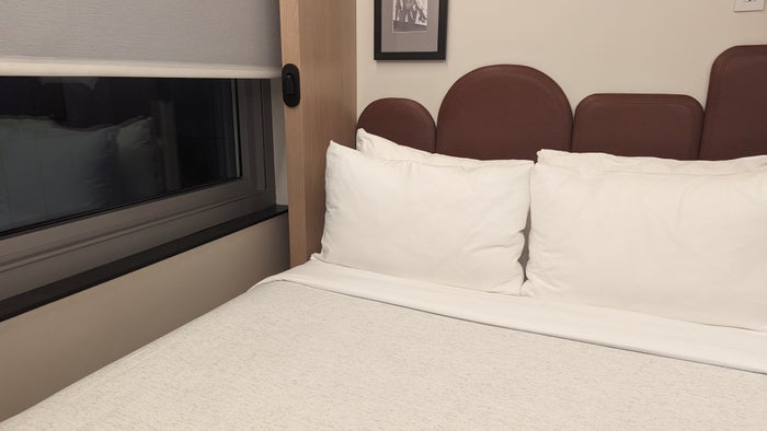 Motto by Hilton New York City Times Square guestroom bedroom window and light Motto by Hilton New York City Times Square guestroom bedroom window and light