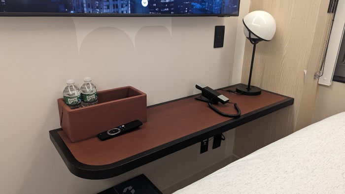 Motto by Hilton New York City Times Square guestroom table with phone and lamp Motto by Hilton New York City Times Square guestroom table with phone and lamp