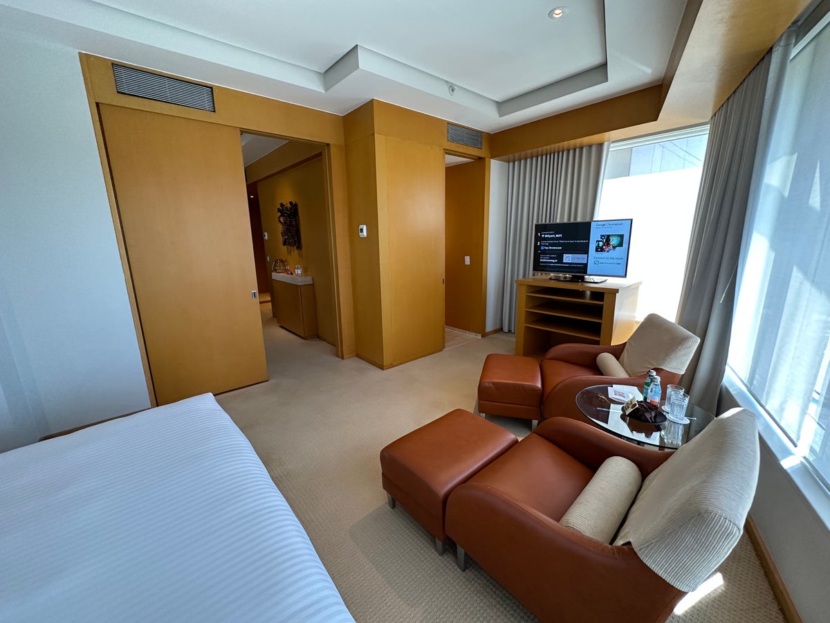Grand Hyatt Sao Paulo suite bedroom bed chairs