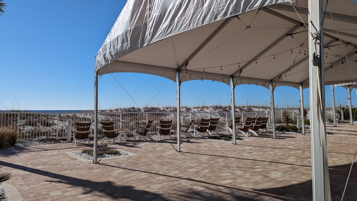 Hilton Pensacola Beach amenities pool tent and seating Hilton Pensacola Beach amenities pool tent and seating