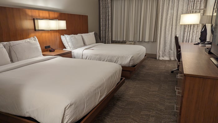Hilton Pensacola Beach guestroom main view with beds Hilton Pensacola Beach guestroom main view with beds