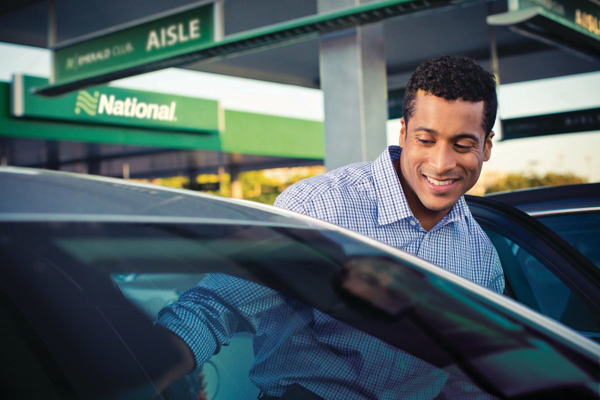 Passenger getting into a National Car Rental vehicle