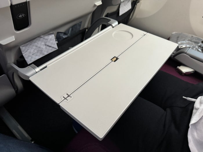 Qatar Airways economy WAW DOH 787 tray table extended Qatar Airways economy WAW DOH 787 tray table extended