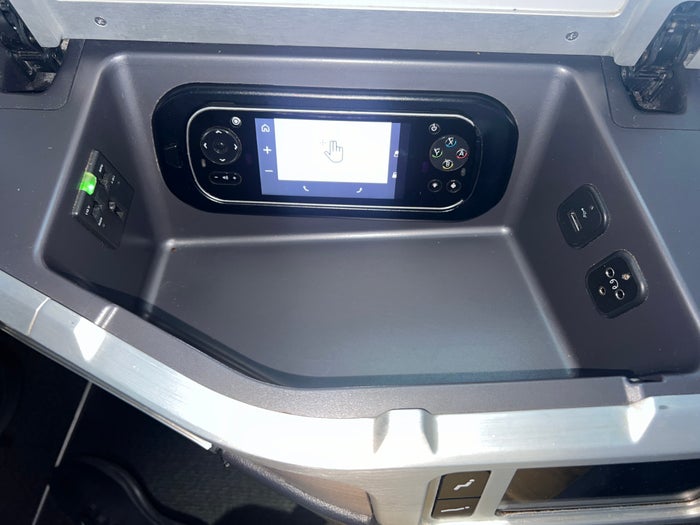 Air Canada business class storage cubby and IFE remote