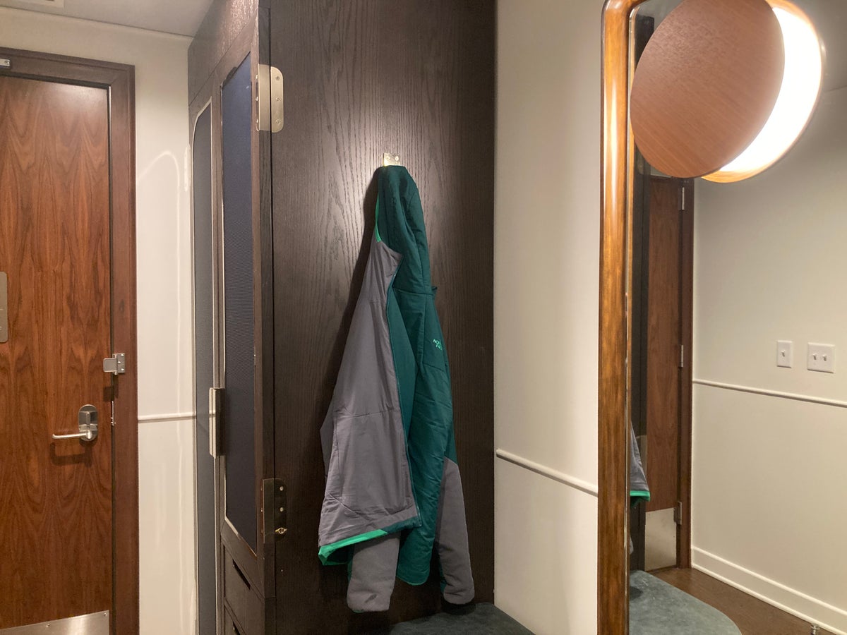Thompson Washington DC junior suite mirror and coat hook near entry