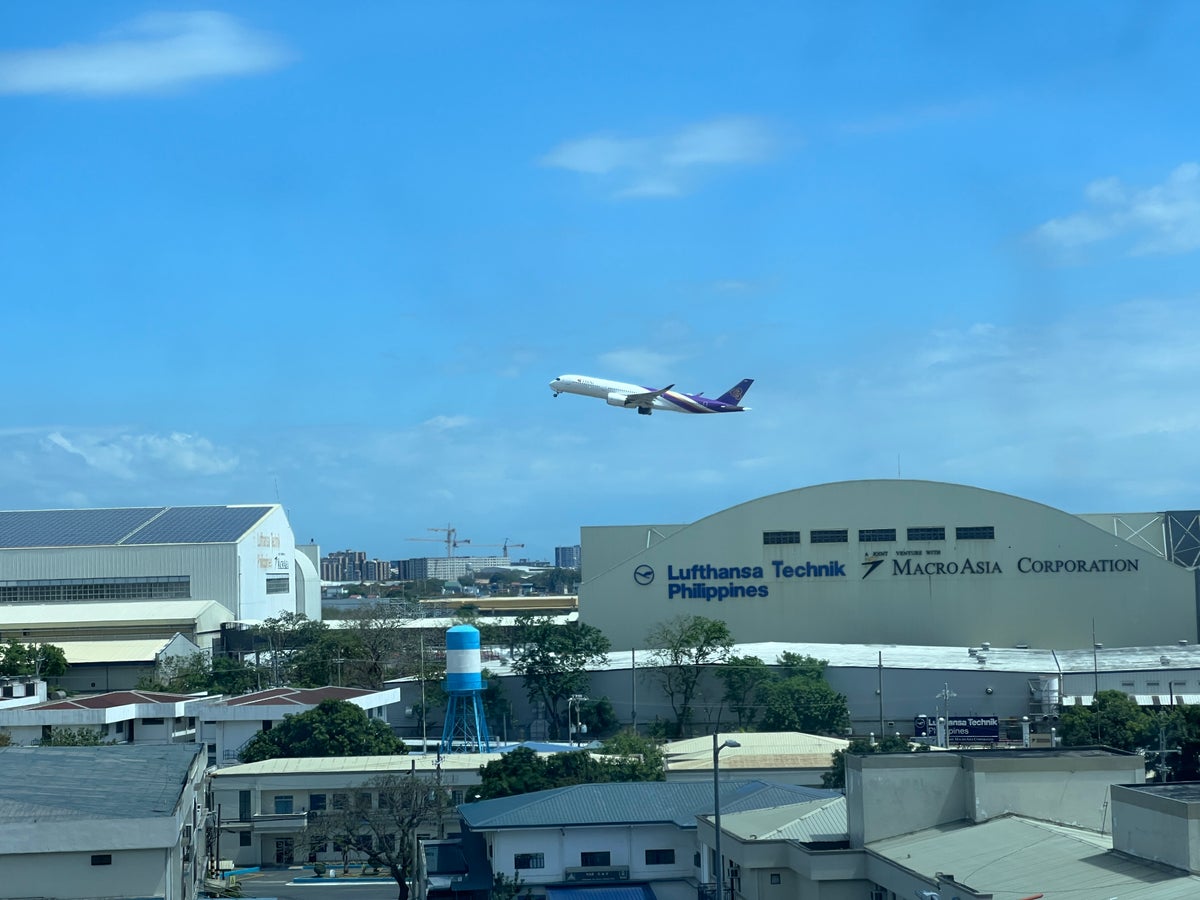 Holiday Inn Express Manila Newport City room view of plane taking off