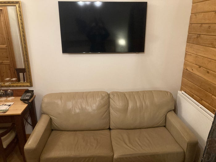 Hotel Ranga deluxe room sofa and TV Hotel Ranga deluxe room sofa and TV