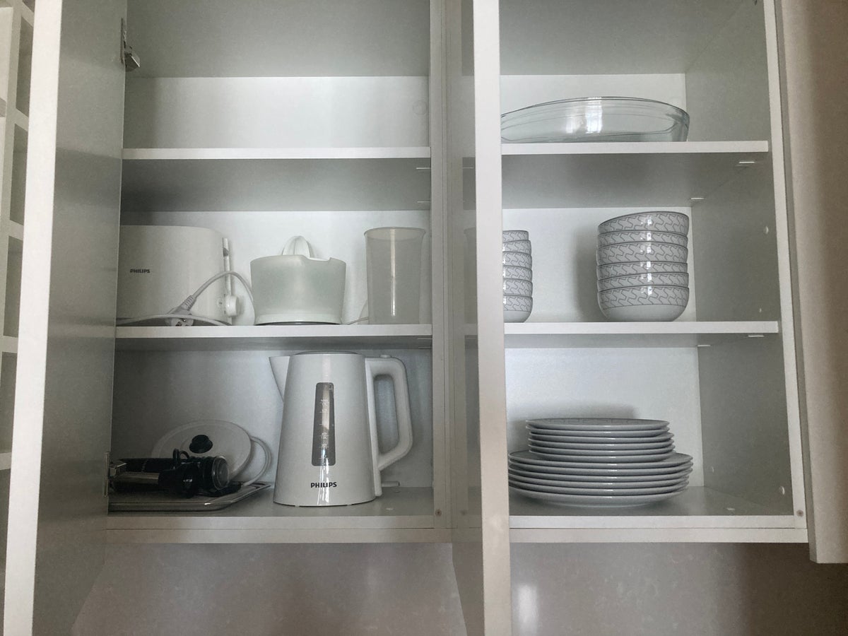 Hyatt Regency Lisbon kitchen dishes in cupboards