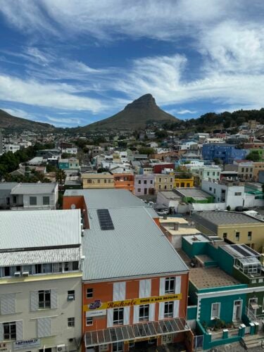 The view from our room showcasing Table Mountain, Lion's Head, and the Bo-Kaap neighborhood.