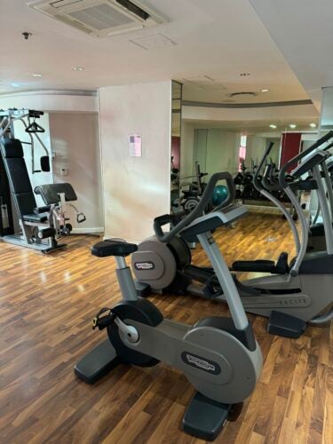 The fitness center at Hyatt Regency Cape Town features several machines and free weights.
