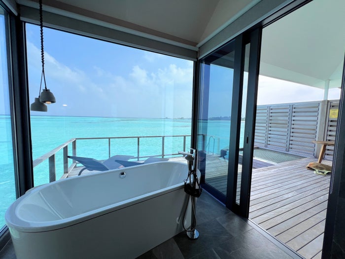 Le Meridien Maldives overwater villa shower opening to deck Le Meridien Maldives overwater villa shower opening to deck