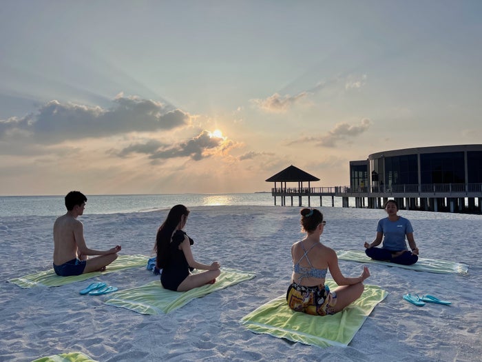 Sunset yoga at Le Meridien Maldives Sunset yoga at Le Meridien Maldives
