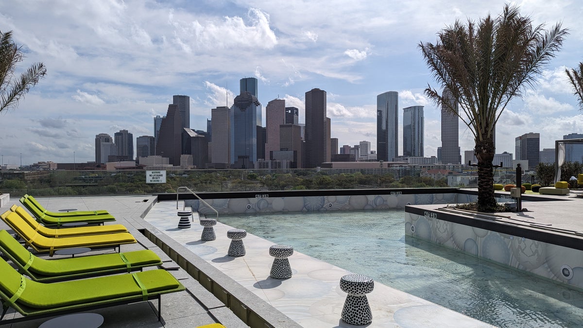 Thompson Houston pool skyline and loungers