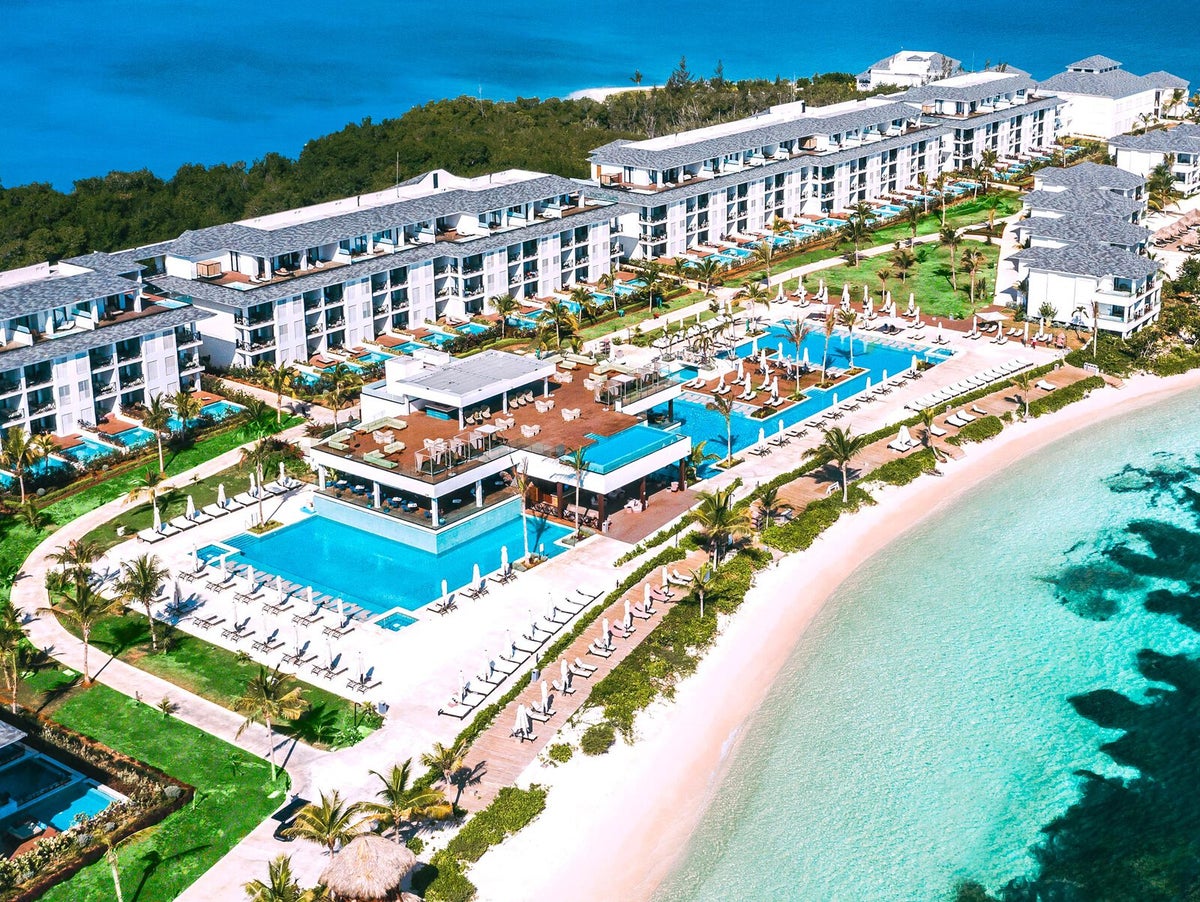 An aerial image of the hotel, pool and beach at Excellence Oyster Bay Jamaica.