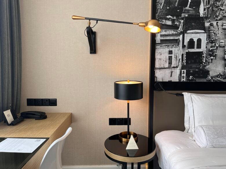 Hotel Stripes Kuala Lumpur Autograph Collection room nightstand and mounted wall lap