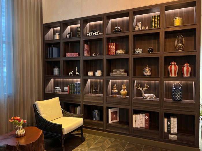Hyatt Place Bangkok Sukhumvit lobby bookshelf and artwork Hyatt Place Bangkok Sukhumvit lobby bookshelf and artwork