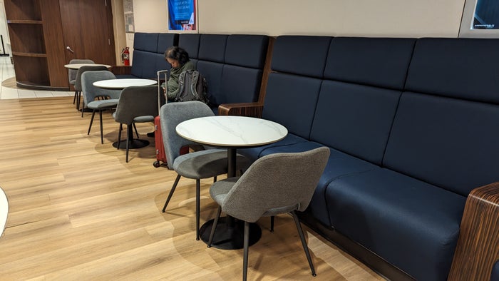KLM Crown Lounge IAH buffet seating with tables KLM Crown Lounge IAH buffet seating with tables