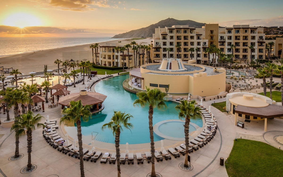 An aerial photo of Pueblo Bonito Pacifica's pool and lounge areas overlooking the ocean.