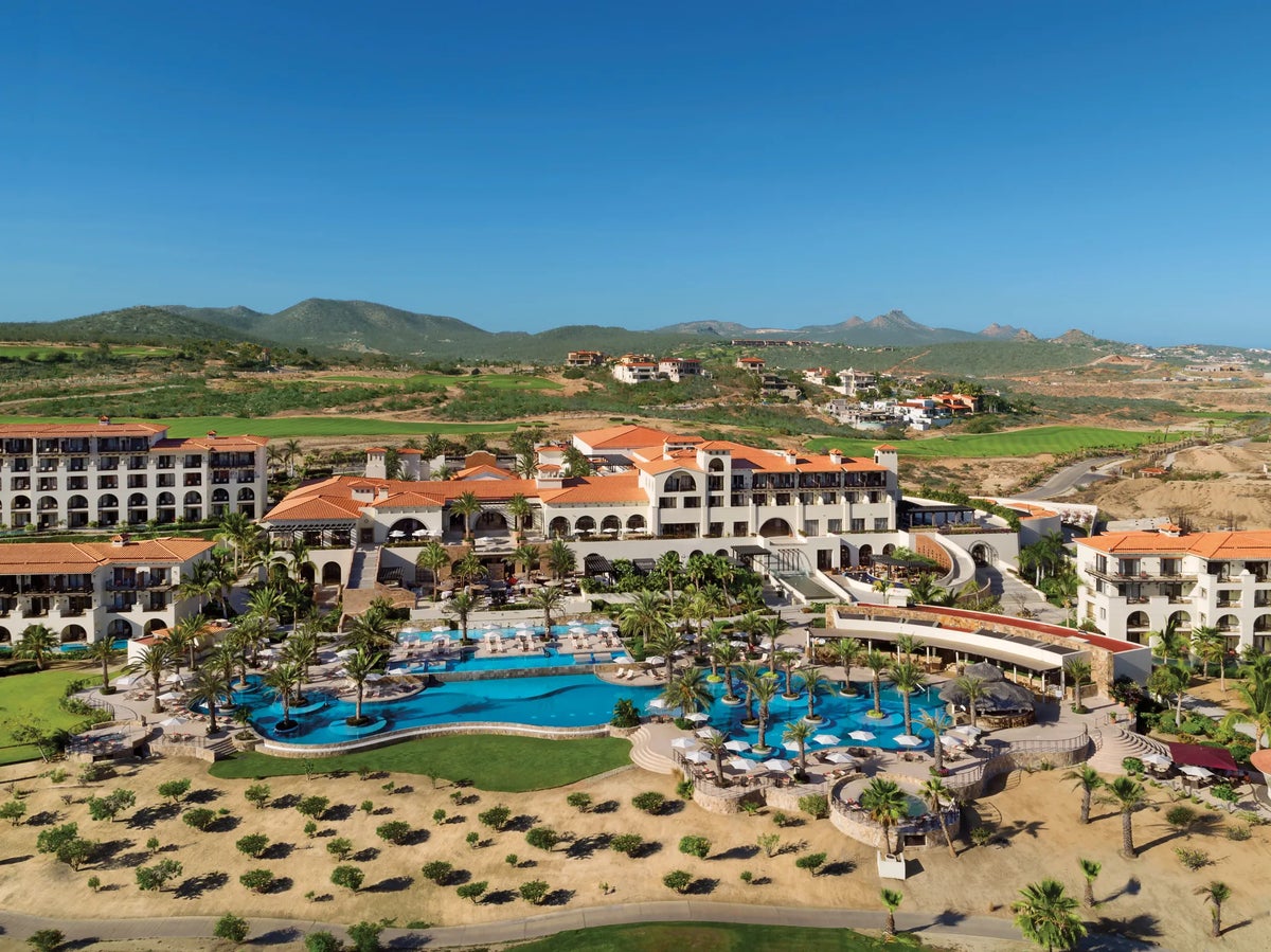 The pool and hotel view of Secrets Puerto Los Cabos Golf and Spa Resort.
