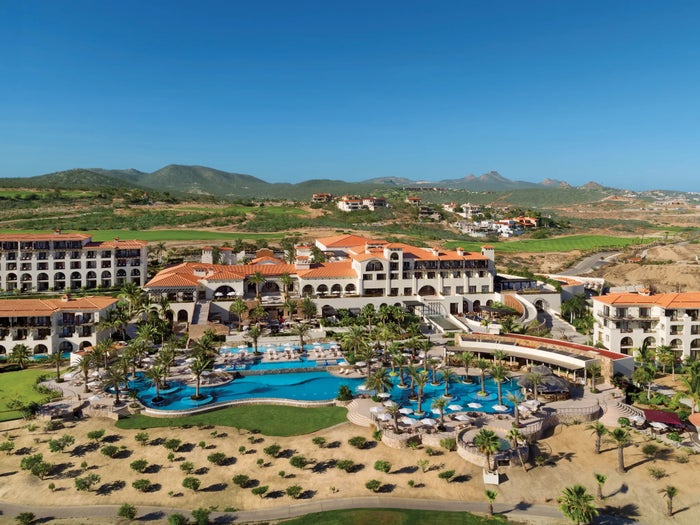 Secrets Puerto Los Cabos Golf and Spa Resort The pool and hotel view of Secrets Puerto Los Cabos Golf and Spa Resort.