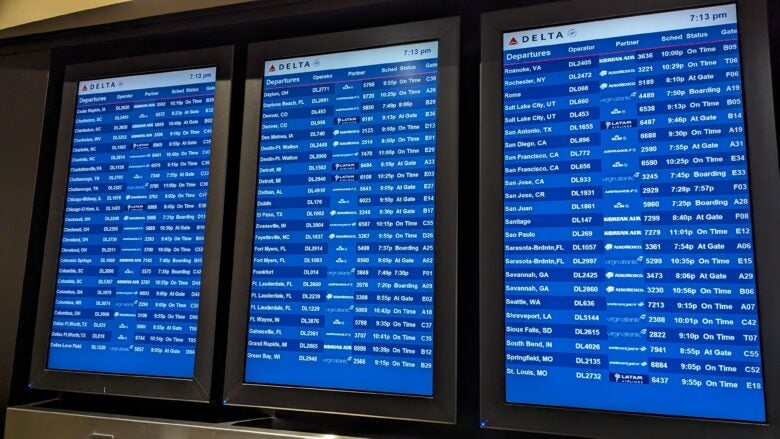 Concourse C Delta Sky Club at Hartsfield Jackson Atlanta International Airport entrance flight information display