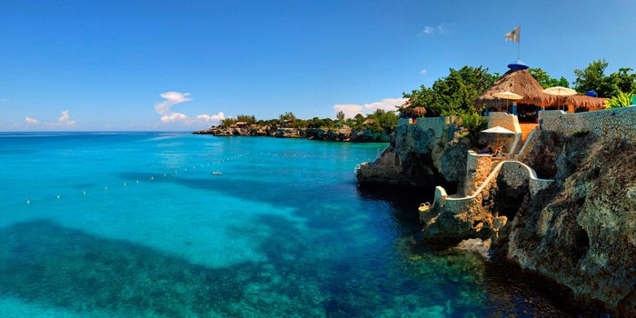 Image of The Caves Jamaica along a cliff.