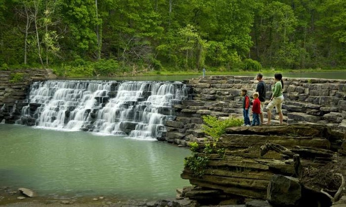Family look at waterfalls Devil's Den State Park Family look at waterfalls Devil's Den State Park