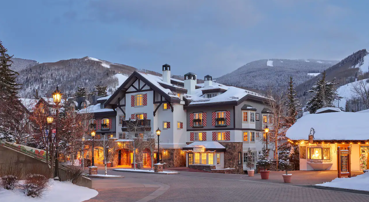 Exterior facade of Austria Haus at night with Vail Mountain in the backdrop