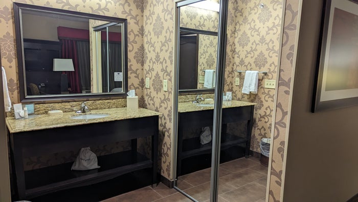 Hampton Inn Suites Hope guestroom bathroom vanity and closet Hampton Inn Suites Hope guestroom bathroom vanity and closet