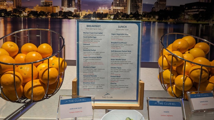 MCO Terminal B The Club MCO Gates 70 99 buffet fruit and hot menu MCO Terminal B The Club MCO Gates 70 99 buffet fruit and hot menu