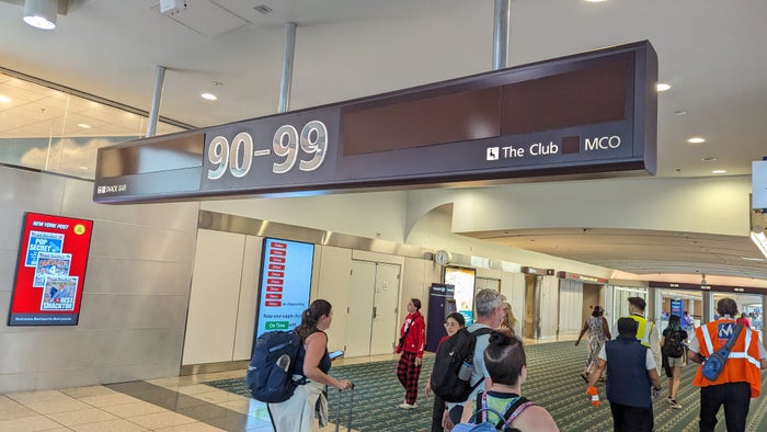 MCO Terminal B gates 70 99 The Club direction sign MCO Terminal B gates 70 99 The Club direction sign