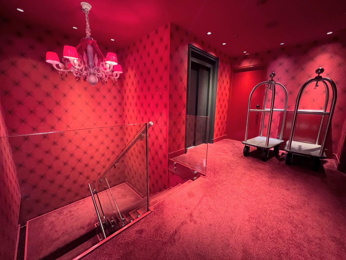 Red stairs down to the gym and spa at Andaz Amsterdam